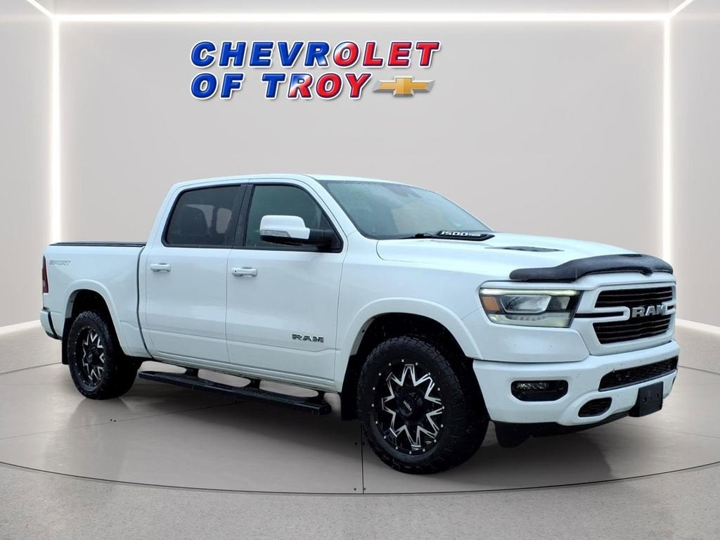 2021 RAM 1500 Laramie Crew Cab 4x4 5'7" Box in White — front three-quarter view