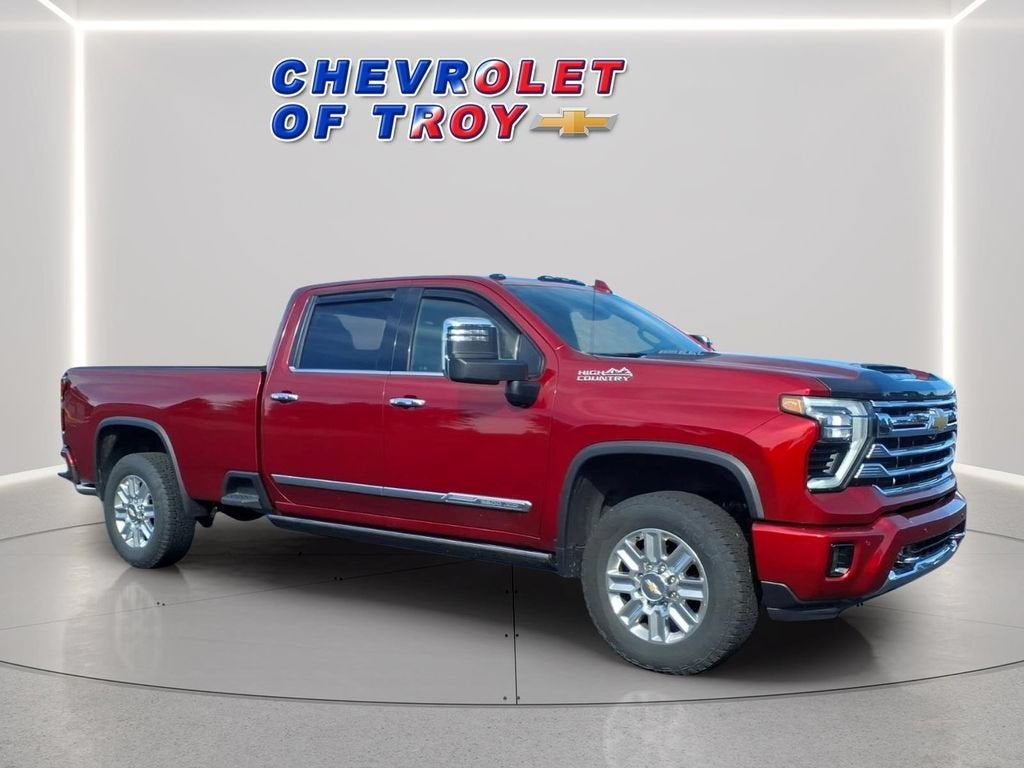 2025 Chevrolet Silverado 3500 HD High Country in Radiant Red Tintcoat — front three-quarter view